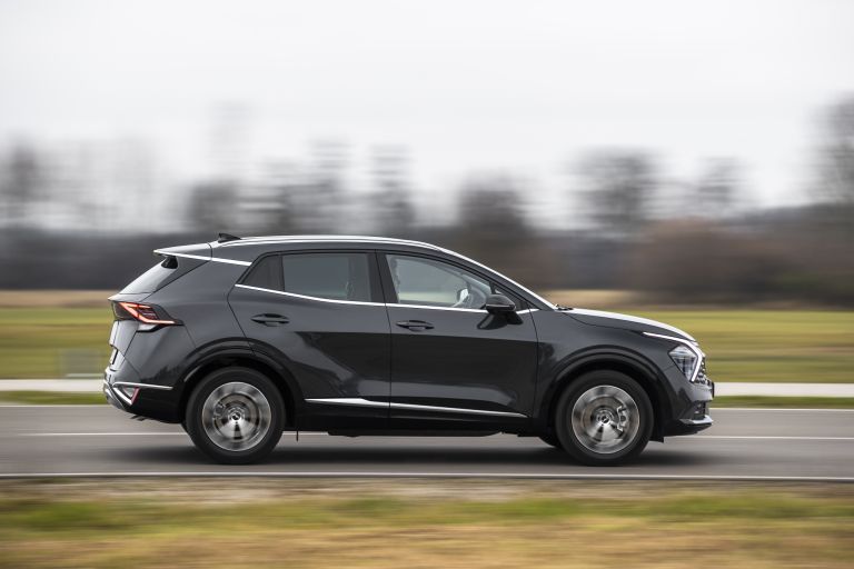 side view of black kia sportage