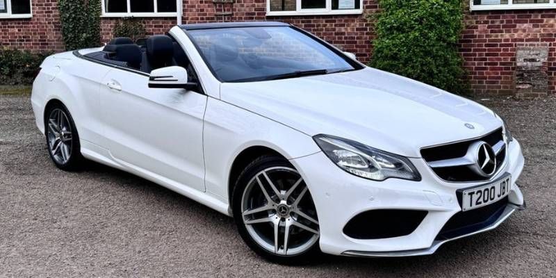 Mercedes-Benz E-Class Cabriolet in AMG Sport Plus trim, showcasing a sleek design and luxurious features.