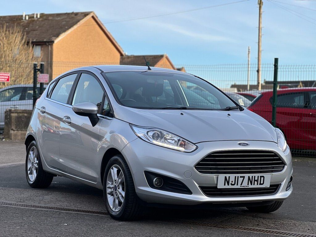 A silver Ford Fiesta parked at Cars 4 You