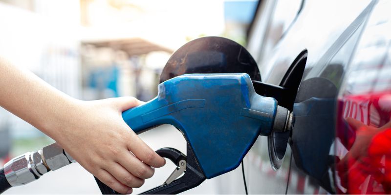 An individual filling vehicle with fuel