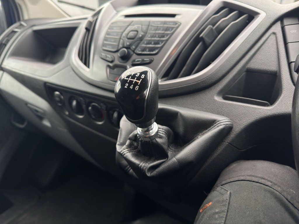 Ford Transit Connect Van, showcasing its compact design and utility in an urban environment.