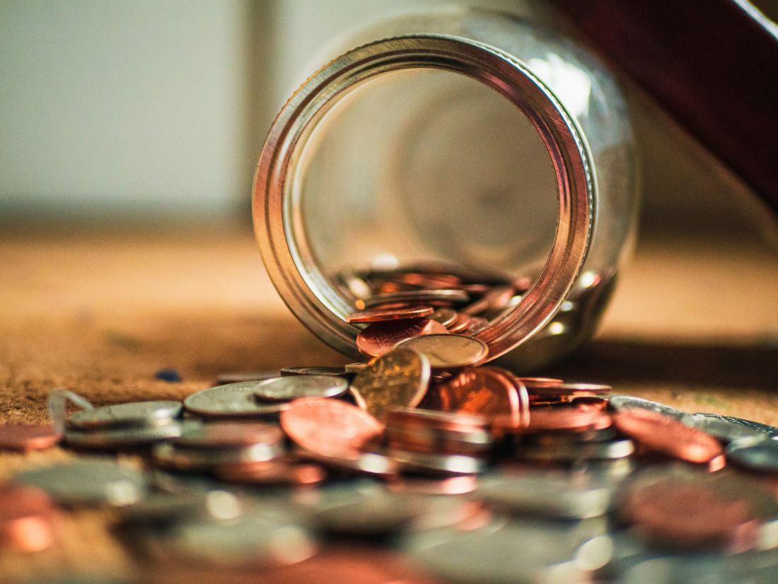 coins falling out of jar