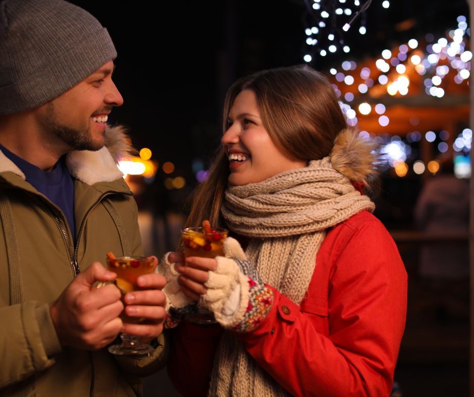happy people holding mulled wine