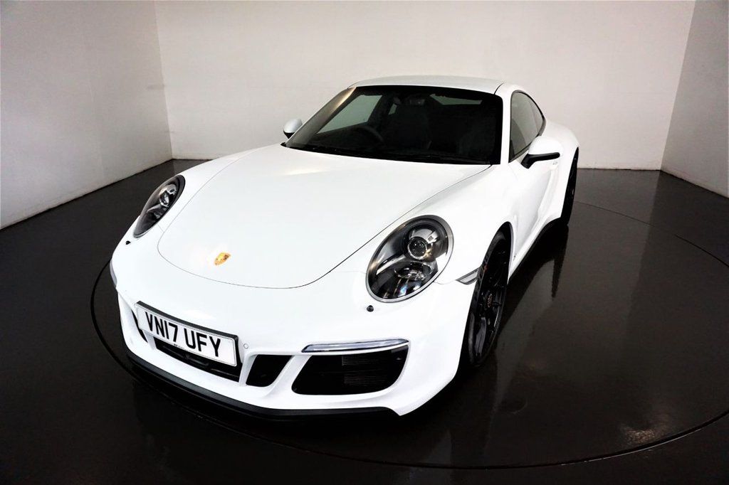 A white Porsche 911 from Rix Motors