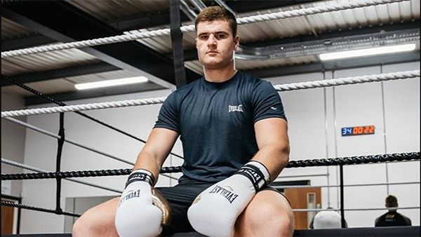 Johnny Fisher in a boxing ring
