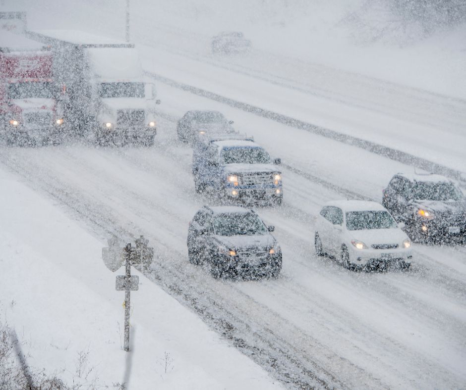 Cars driving in the snow on motorway