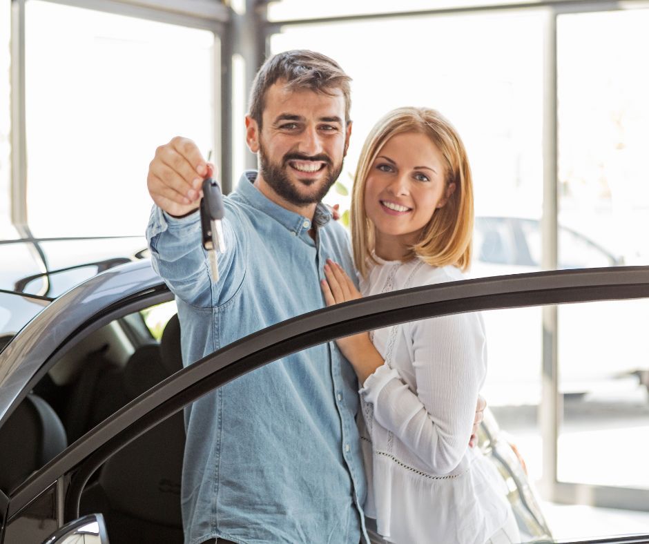 happy couple buying a car