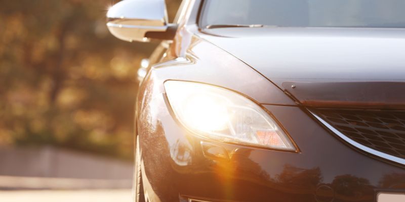 A car with it's headlights on 