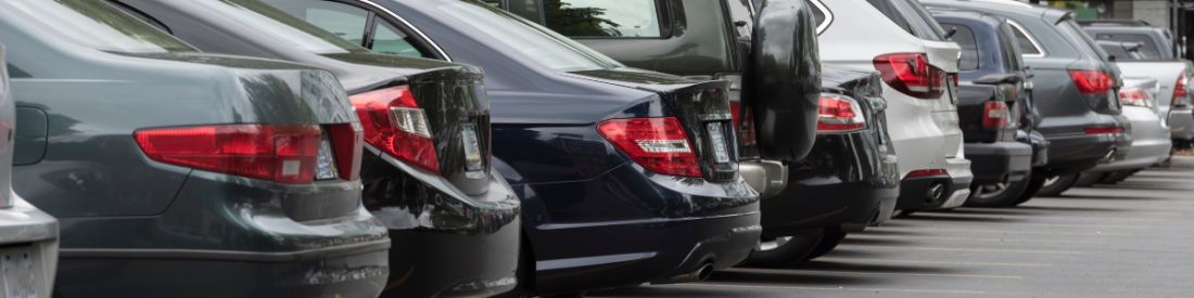 Row of parked cars representing car finance options for self-employed people.