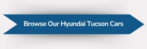 Blue ribbon-shaped banner with white text reading ‘Browse Our Hyundai Tucson Cars’