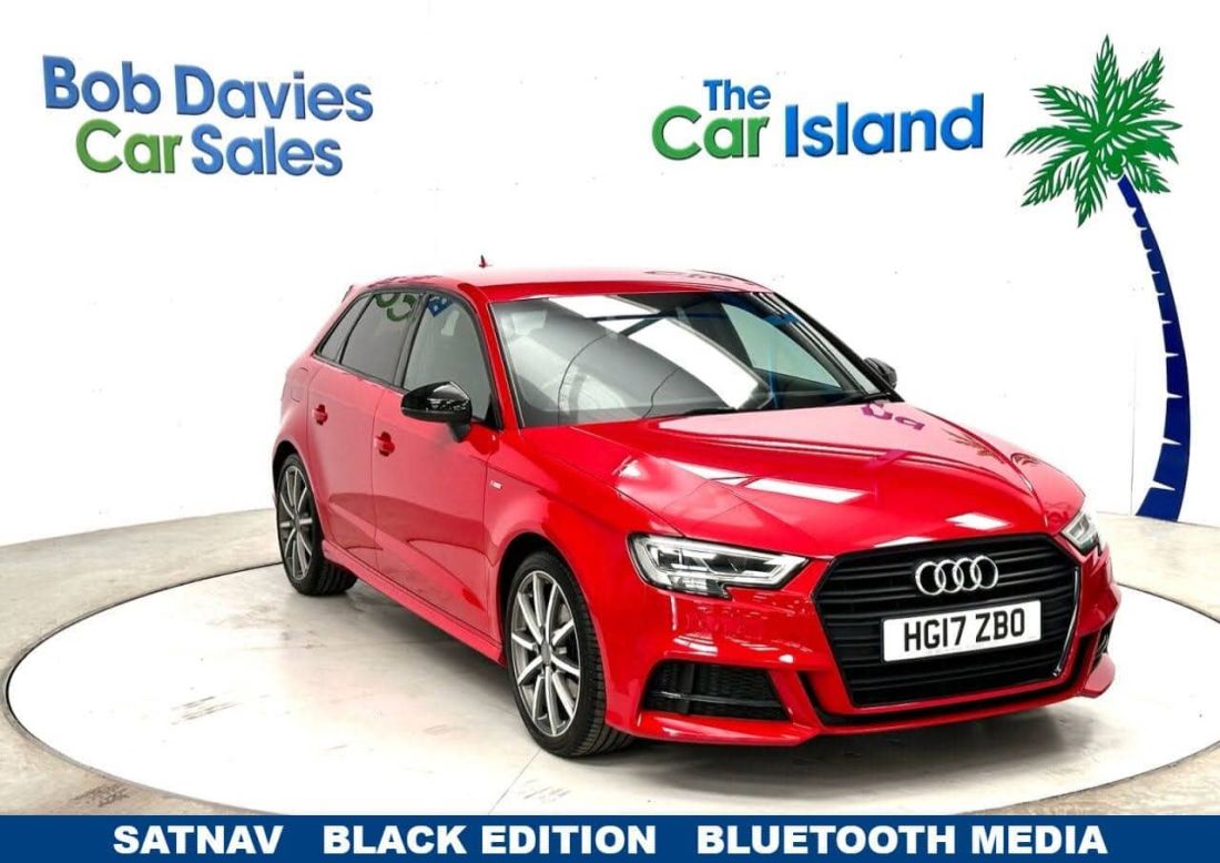 An images featuring an red Audi car, surrounded by an island set up with Bob Davies Car Sales.