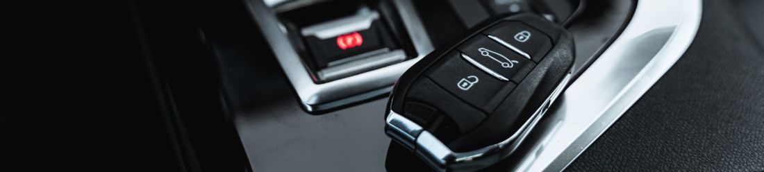 Interior view of a used car featuring a key on the dashboard.