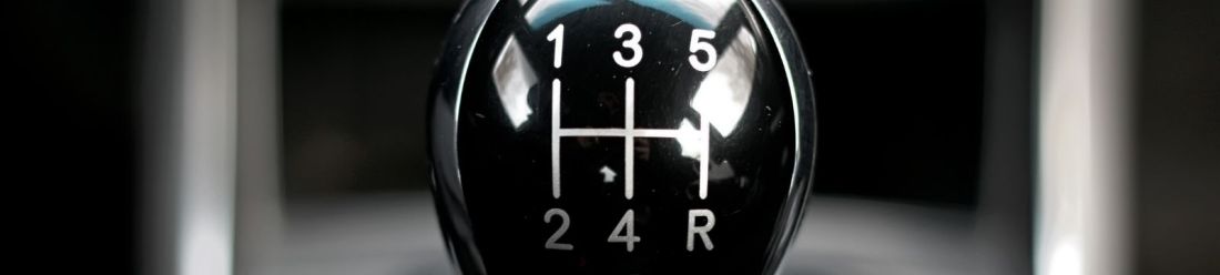 A close-up view of a gearstick in a car.