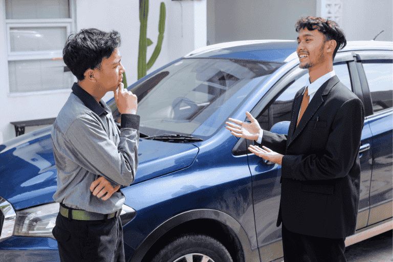 Two men discussing a cars value and part-exchange options