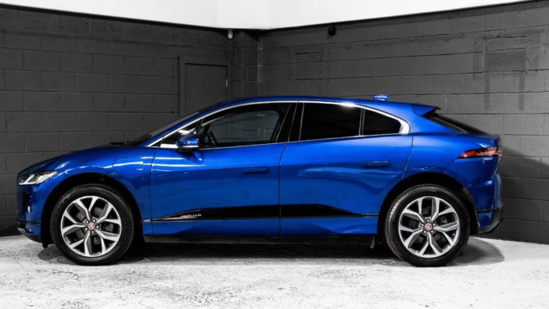 Side view of a blue Jaguar I-Pace.