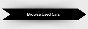 Black ribbon-shaped button with white text that reads 'Browse Used Cars'