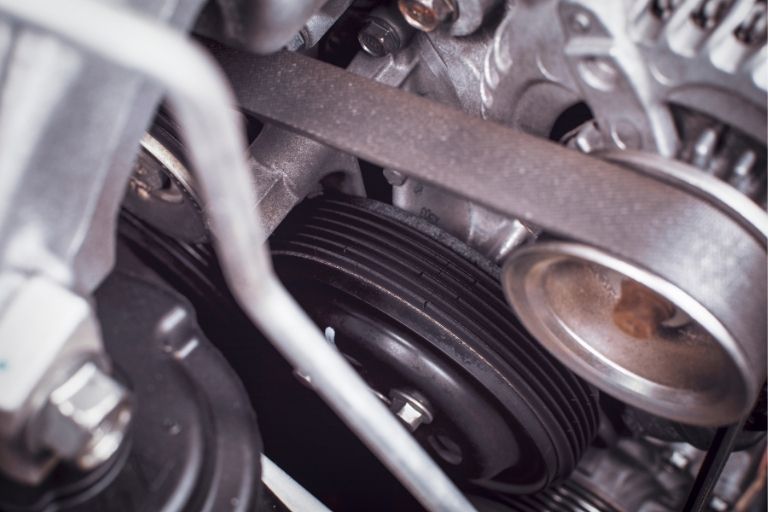 Car timing belt under a bonnet.