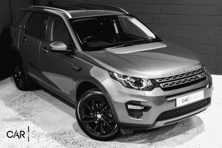 Land Rover Discovery sport in Car Synergy's showroom.