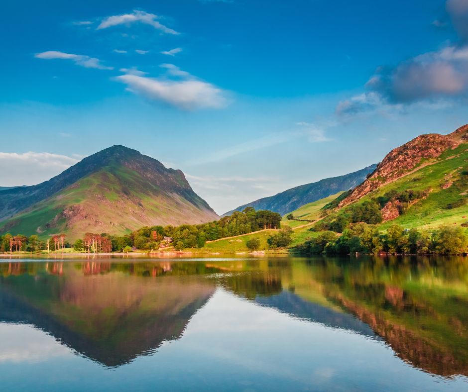 A mountain landscape reflected in the water.