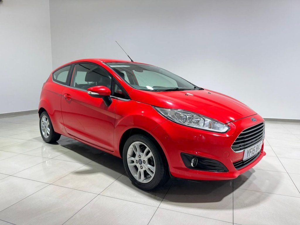 Ford Fiesta parked in a modern showroom, showcasing its sleek design and vibrant colour. 