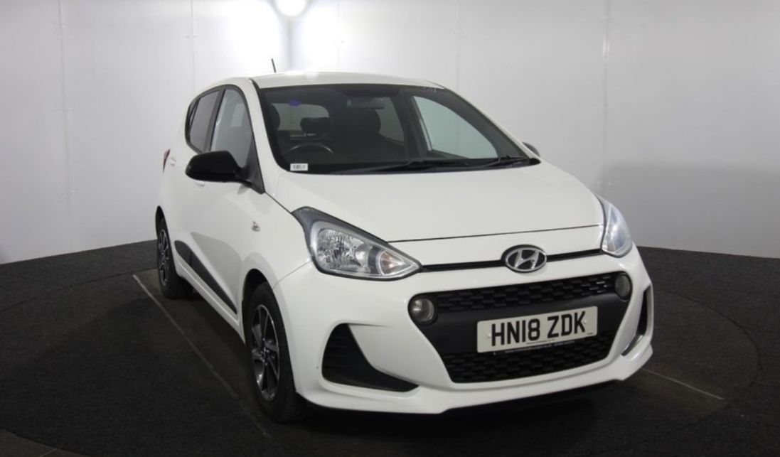 White Honda car in a car showroom