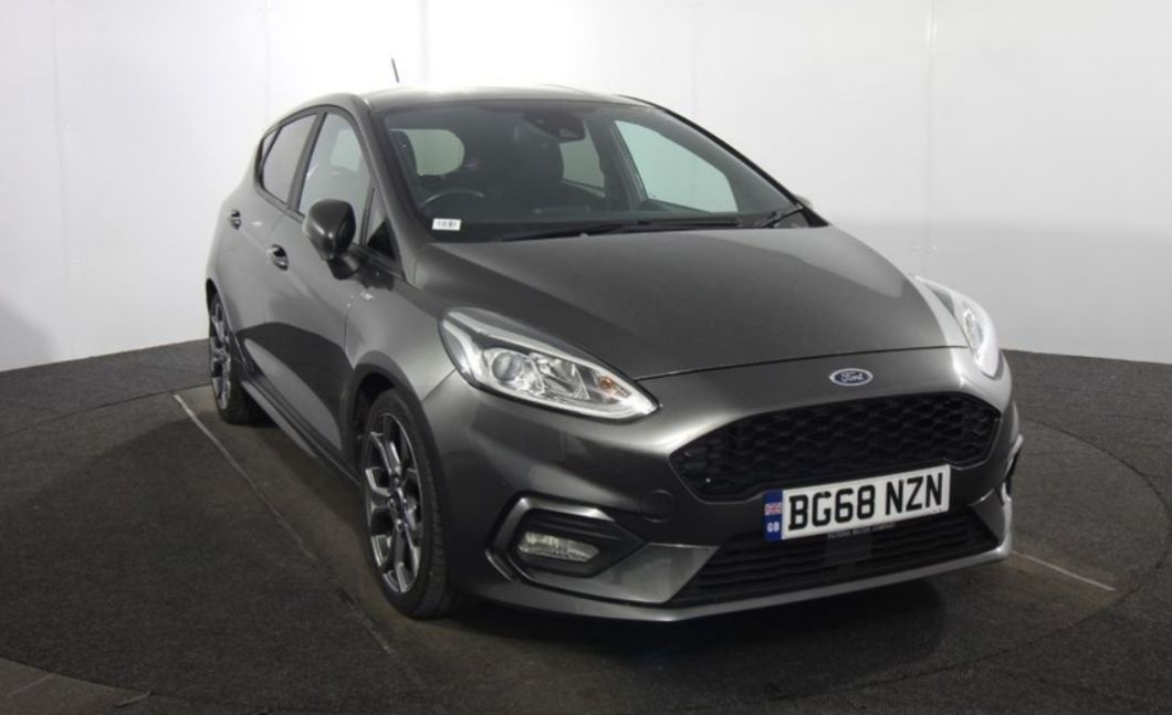 Silver Ford car in a car showroom