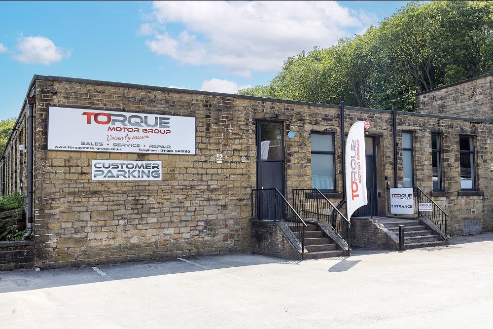 Exterior of Torque Motor Group in Huddersfield with customer parking.
