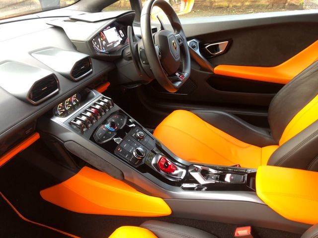 Lamborghini Huracán interior with orange leather seats.