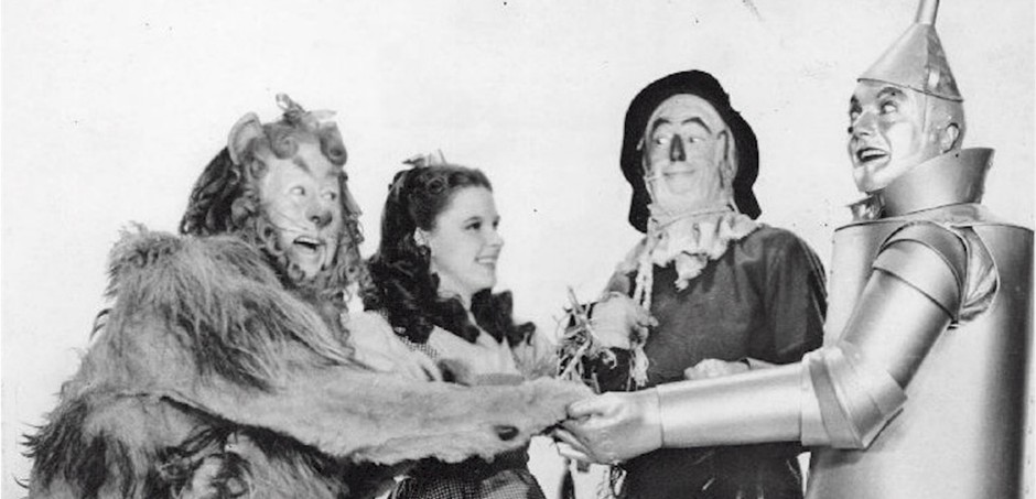 Cast of The Wizard of Oz in classic black and white photo.