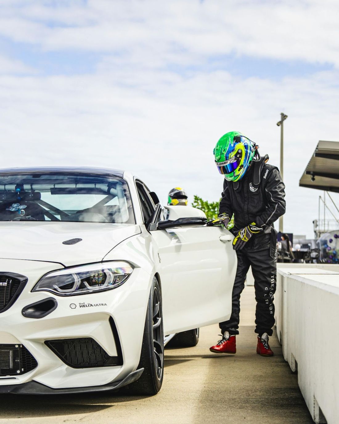 A white BMW, showcasing its sleek design and competitive spirit on the track.