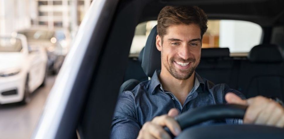 Man test driving a car for the first time