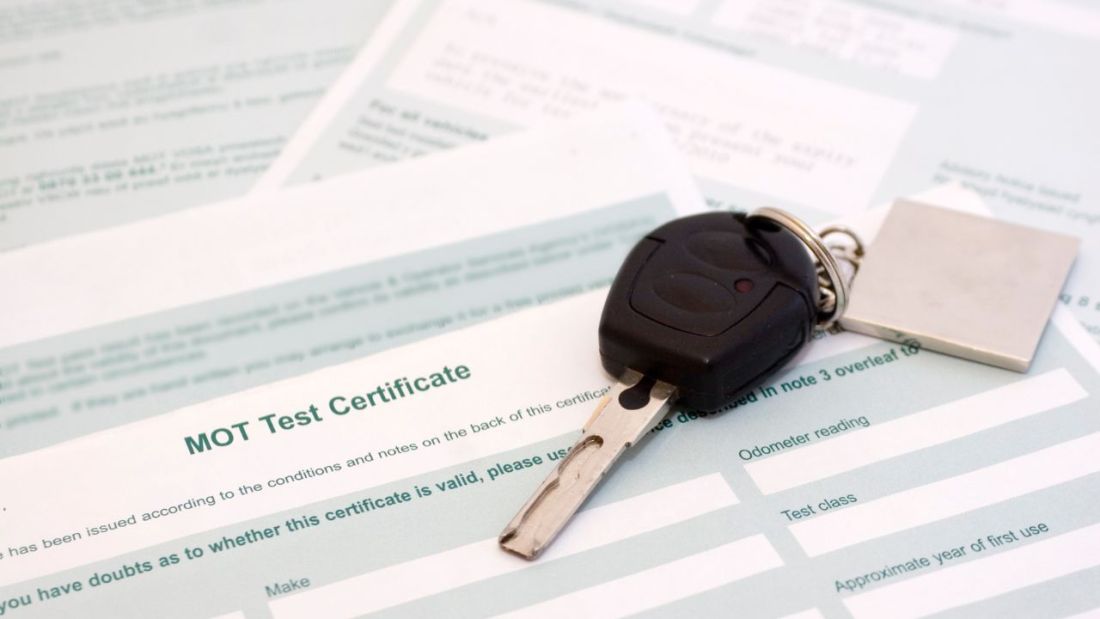 MOT Test Certificate with Car Keys On Top