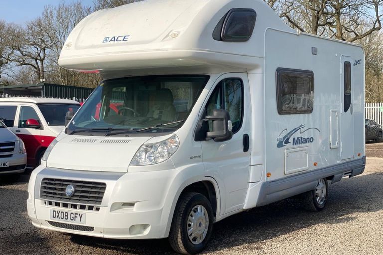 White Ace Milano motorhome parked in front of other vehicles.