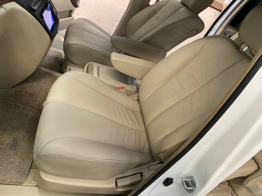 Detailed view of professionally conditioned Nissan Elgrand leather seats, highlighting the clean, high-quality finish before delivery.