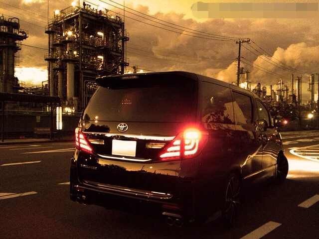Toyota Vellfire rear view showing a bright red fog light expertly integrated into the original light cluster for UK MOT compliance.