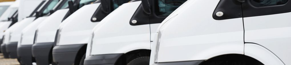 White vans parked up and photographed diagonally