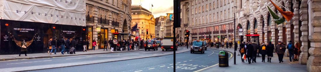 A lively street in London crowded with people strolling, highlighting the vibrancy and energy of city life.