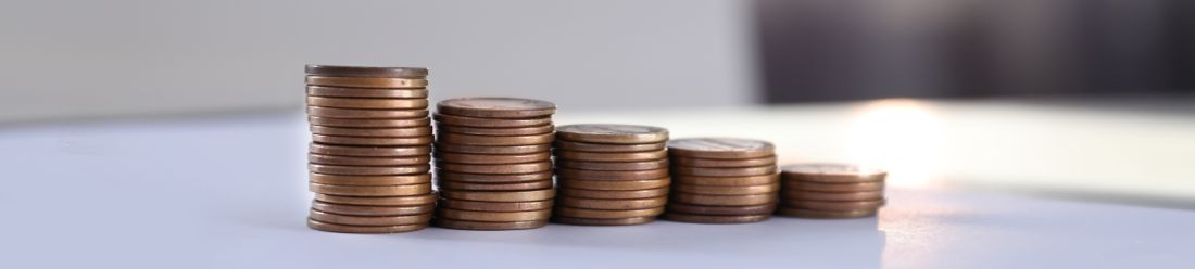 Stacked coins arranged in ascending order.