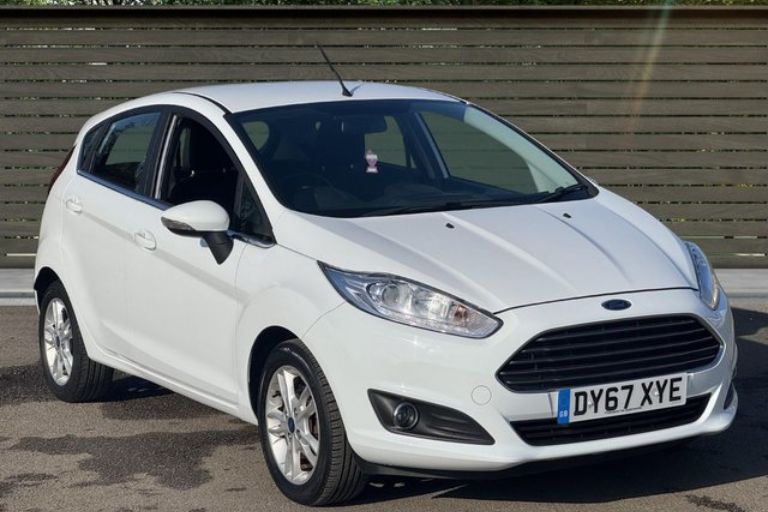 Front angle view of white Ford Fiesta showing compact family hatchback design.
