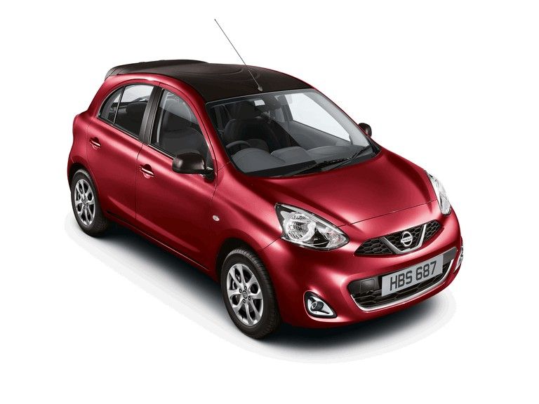 Red Nissan Micra hatchback with black roof on a white studio background.