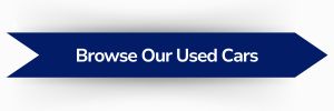 Blue ribbon-shaped banner with white text reading ‘Browse Our Used Cars'