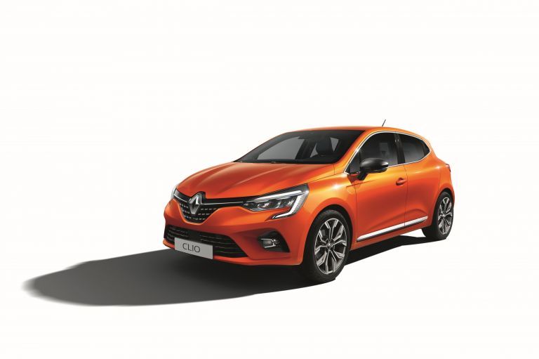 Orange Renault Clio hatchback on a white studio background.