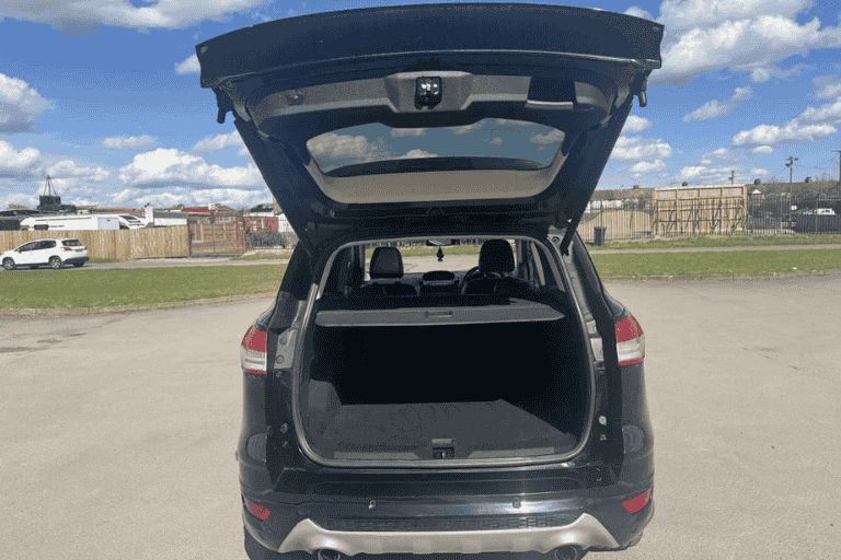 Open boot space of SUV with parcel shelf and spacious luggage area.