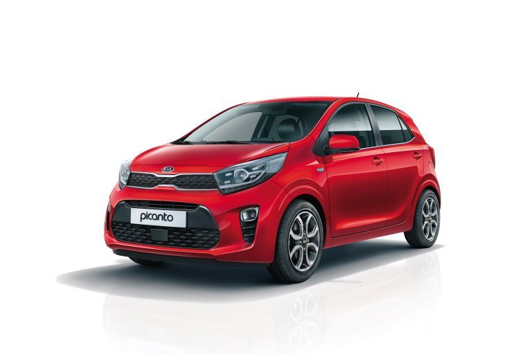Kia Picanto photographed in a white showroom.