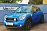 USED 2012 12 MINI COUNTRYMAN 1.6 COOPER S ALL4 5d 184 BHP Spotless Metallic Blue example with optional 18" Anthracite Alloys, Chili & Media Pack, Panoramic Glass Sunroof, Navigation, Bluetooth & Rear Sensors