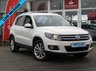 USED 2013 13 VOLKSWAGEN TIGUAN 2.0 SE TSI 4MOTION 5d 178 BHP STUNNING, RARE 4X4, VOLKSWAGEN TIGUAN 2.0 SE TSI 4 MOTION, 178 BHP. Finished in CANDY WHITE with contrasting CLOTH/ALCANTARA trim. This Rare 2.0 TFSI petrol Tiguan has a more sophisticated look to add to its high quality interior and high spec. In short this Tiguan is spacious, comfortable and great to drive, while its raised driving position gives you a great view. Comes with 12 months MOT