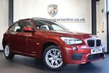 USED 2012 12 BMW X1 2.0 SDRIVE20D M SPORT 5DR AUTO 174 BHP full bmw service history FINISHED IN STUNNING VERMILLION METALLIC RED WITH FULL BLACK LEATHER INERIOR + FULL BMW SERVICE HISTORY + SATELLITE NAVIGATION + REVERSE CAMERA + PANORAMIC ROOF + HEATED SPORT SEATS + PARKING SENSORS + RAIN SENSORS + AUTO AIR CON + M SPORT PACKAGE + 17" ALLOY WHEELS