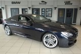 USED 2014 14 BMW 6 SERIES 3.0 640D M SPORT 2d AUTO 309 BHP FINISHED IN STUNNING CARBON BLACK WITH FULL NAPA CREAM LEATHER SEATS + FULL BMW SERVICE HISTORY + PRO SATELLITE NAVIGATION + HEADS UP DISPLAY + REVERSE CAMERA + WIRELESS CHANRGING + HEATED FRONT COMFORT SEATS WITH MEMORY + 19 INCH ALLOYS + ENHANCED BLUETOOTH + DIGITAL COCKPIT + DAB RADIO + TINTED GLASS + CRUISE CONTROL