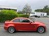 USED 2011 61 BMW 1 SERIES 3.0 1M 2d   2011 BMW 1 Series M Coupe (1M) is a modern classic and a purists dream.  1 owner from new, This ultra-rare, aggressively styled coupe pairs a 335-hp twin-turbo inline-six with a 6-speed manual and a rear-wheel-drive layout. Finding one in the launch Valencia Orange with just 5,000 miles represents a highly sought-after, appreciating investment-grade collector piece 