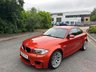 USED 2011 61 BMW 1 SERIES 3.0 1M 2d   2011 BMW 1 Series M Coupe (1M) is a modern classic and a purists dream.  1 owner from new, This ultra-rare, aggressively styled coupe pairs a 335-hp twin-turbo inline-six with a 6-speed manual and a rear-wheel-drive layout. Finding one in the launch Valencia Orange with just 5,000 miles represents a highly sought-after, appreciating investment-grade collector piece 